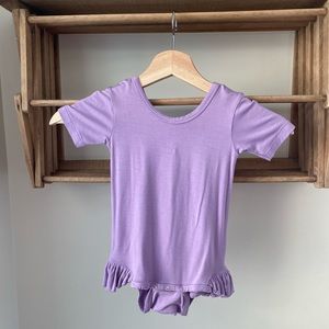 Kate Quinn, new with tags, short sleeve, ruffle leg, bodysuit. Size 12-18m